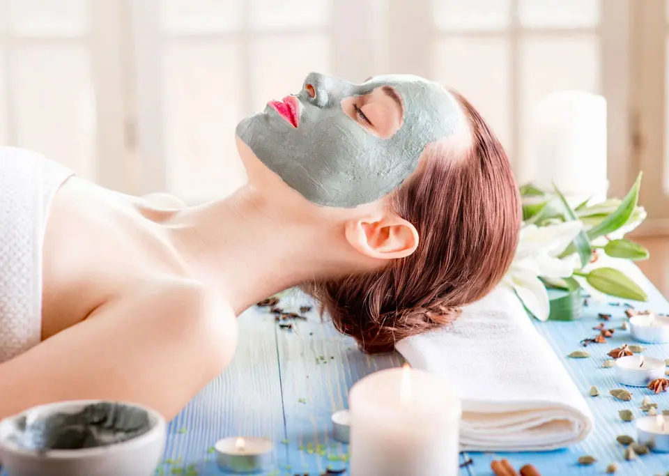 A woman with facial mask on her face.